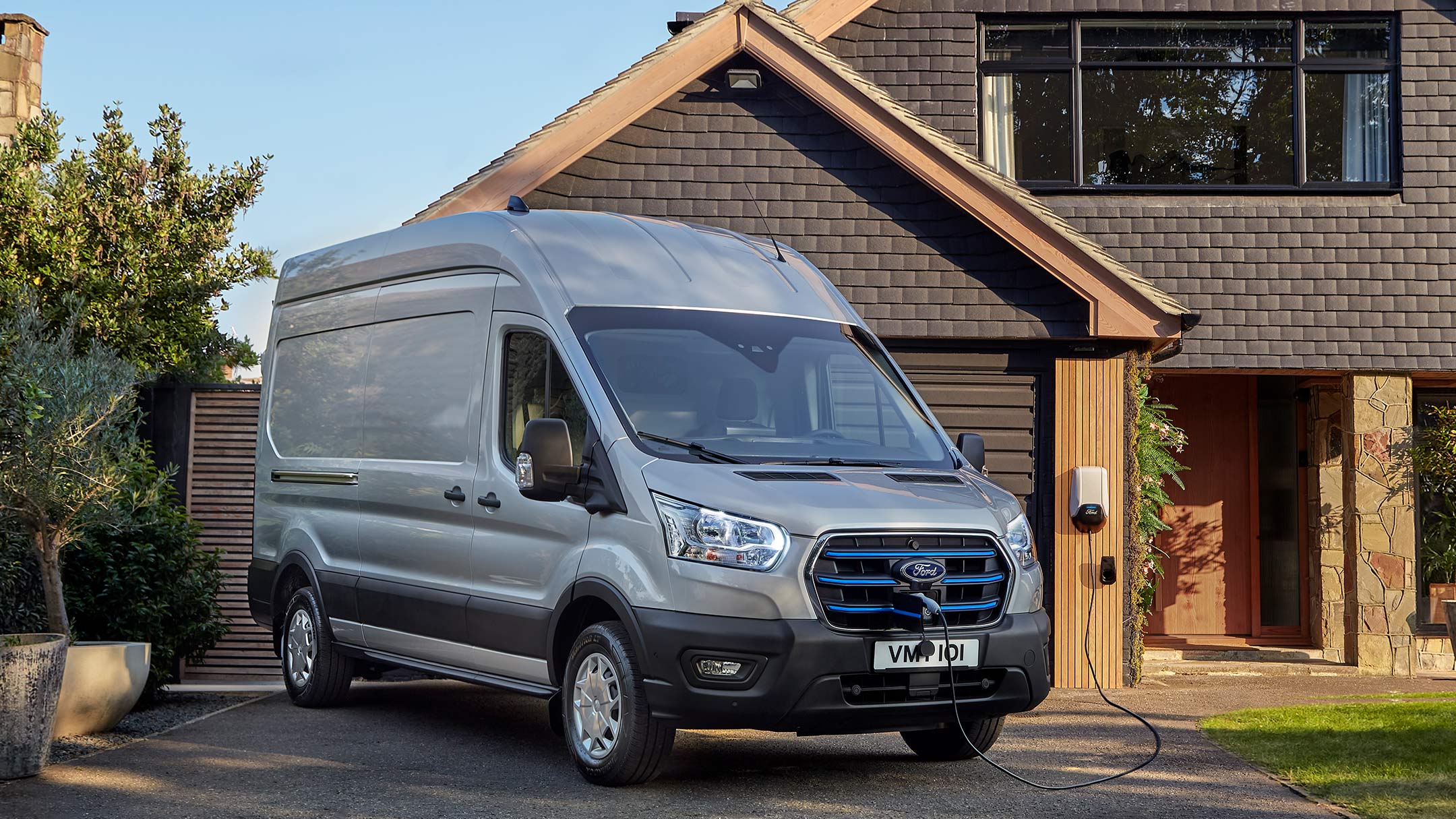 Ford E-Transit parked on house drive